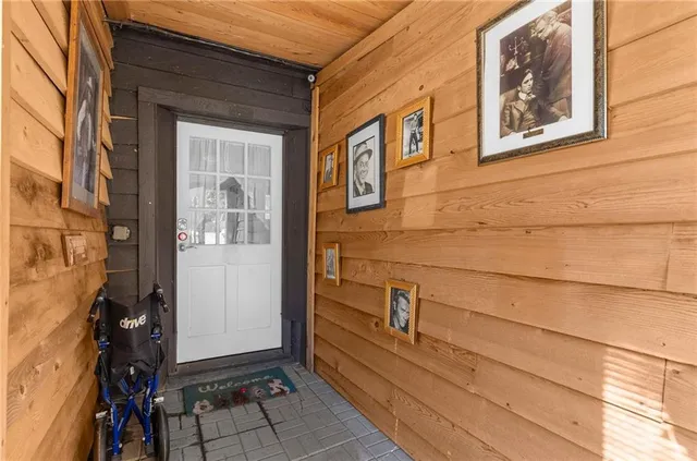 a view of a door and an empty room