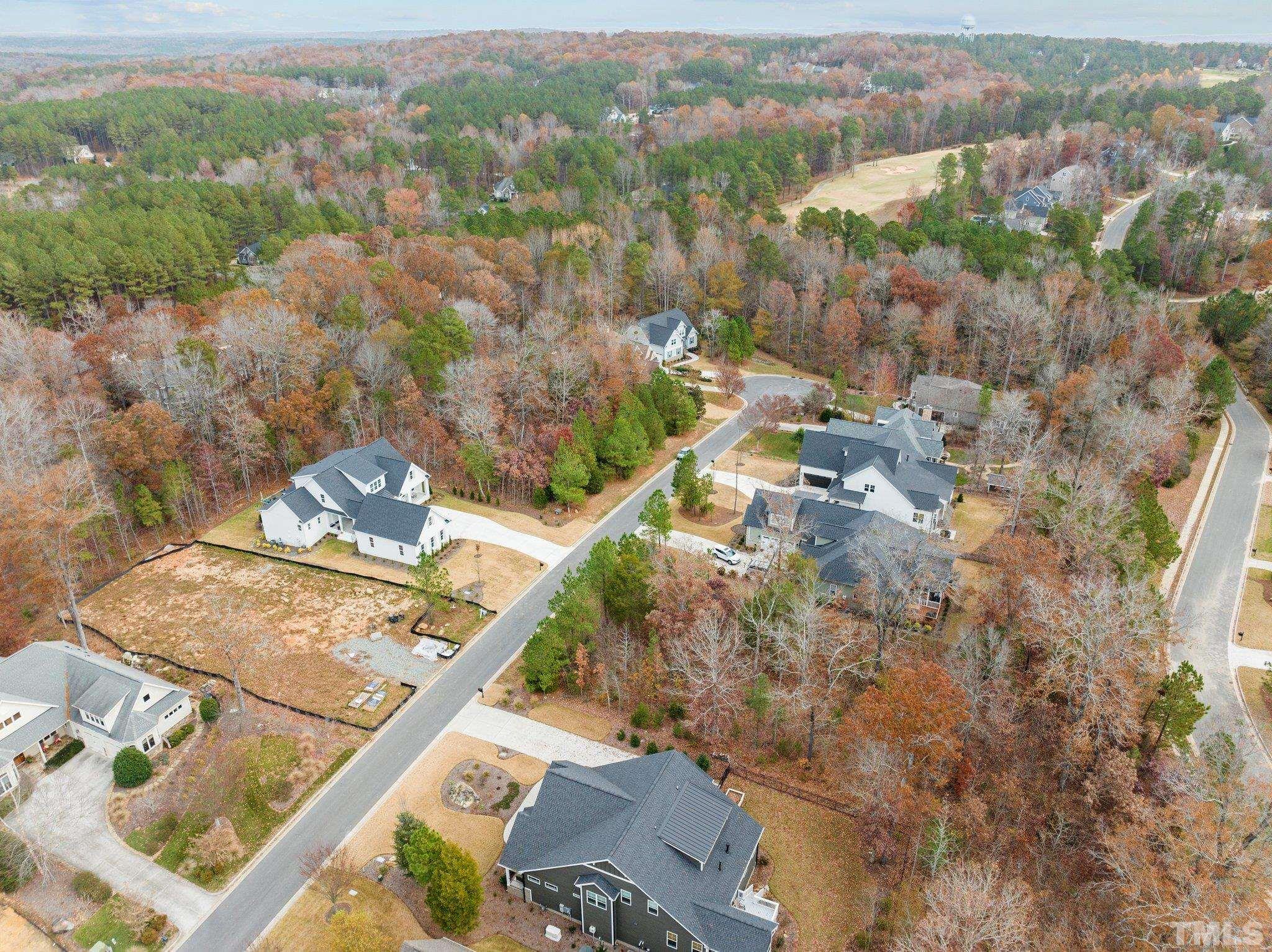 162 Lookout Ridge Pittsboro, NC 27312 - Photo 19 of 37 an aerial view of a house with a yard