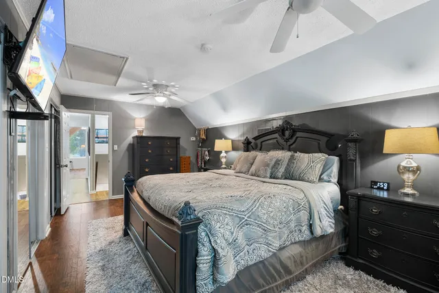 a view of a lake with boats and trees in the background