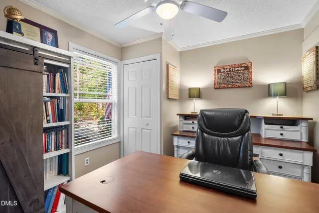 a view of a swimming pool with a table and chairs