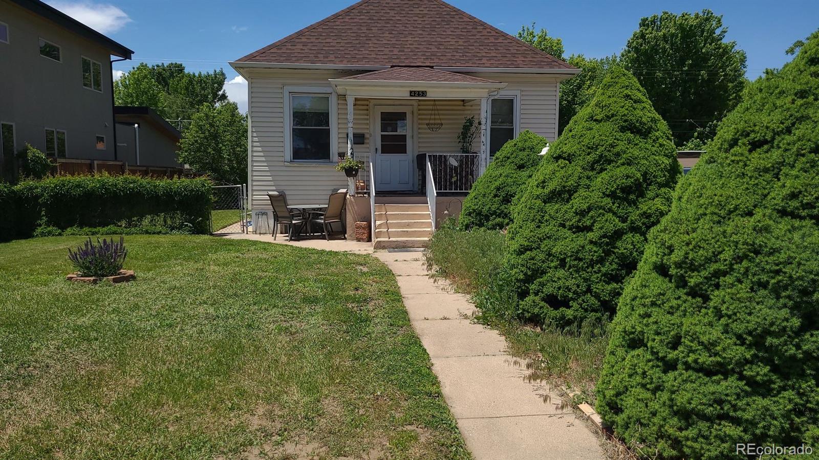 4253 Perry Street Denver, CO 80212 - Photo 3 of 8 front view of a house with a yard