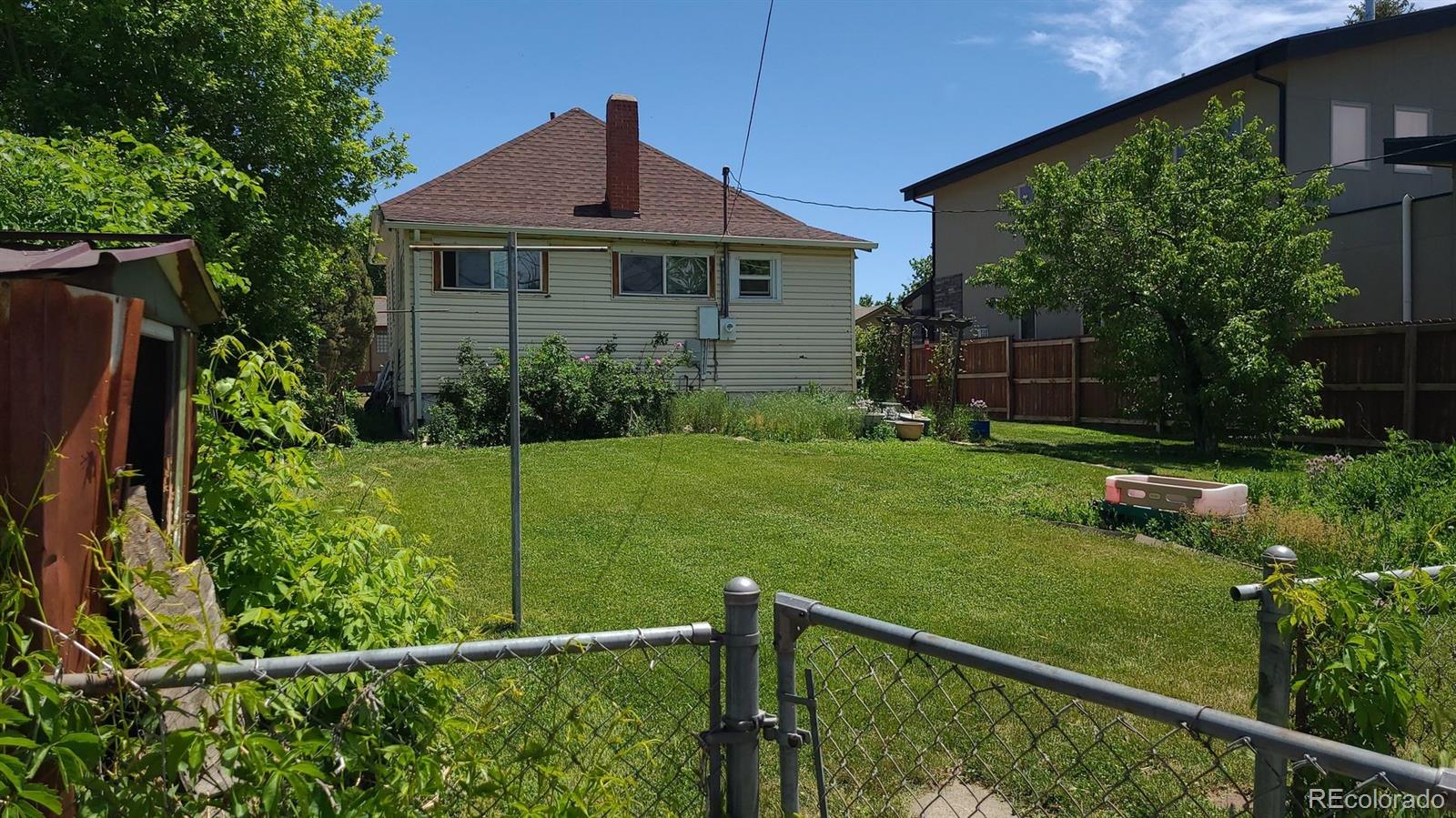 4253 Perry Street Denver, CO 80212 - Photo 8 of 8 a front view of a house with garden