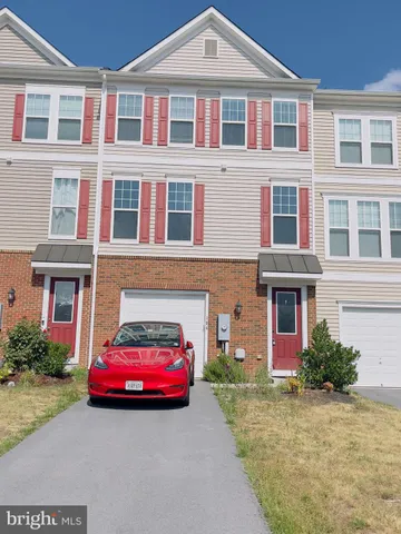 a car parked in front of a house