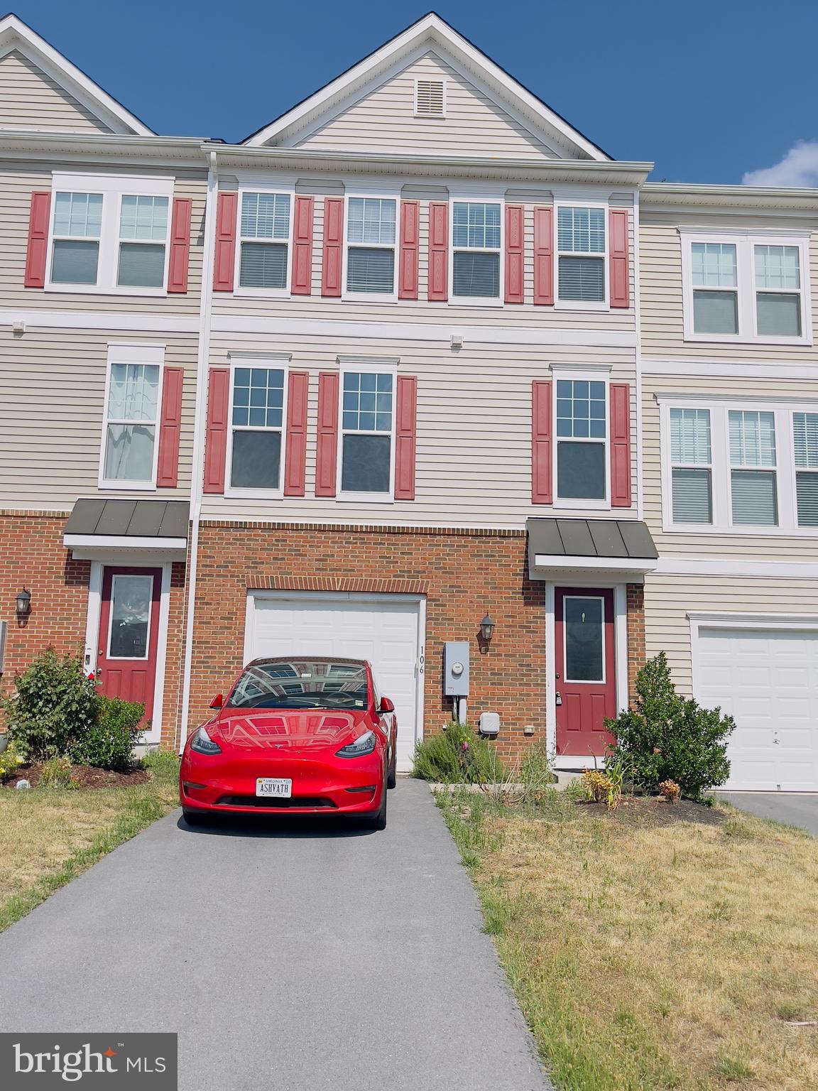 a car parked in front of a house