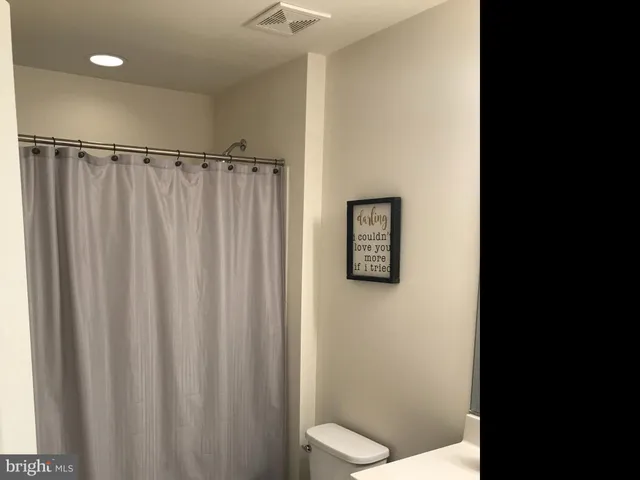 a bathroom with a shower and a toilet