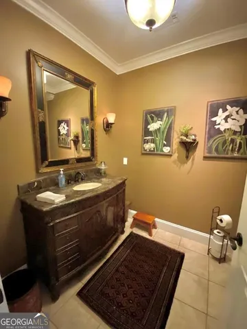 a view of hallway with stairs and wooden floor