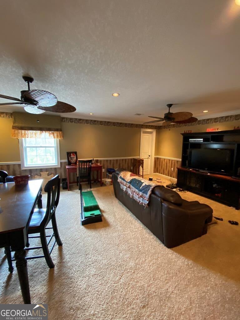 3 Chestnut Road Hazlehurst, GA 31539 - Photo 24 of 66 a living room with furniture and a flat screen tv