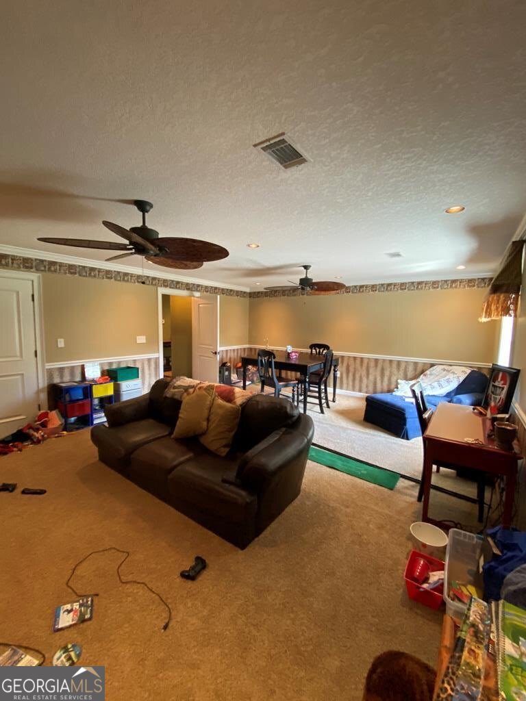 3 Chestnut Road Hazlehurst, GA 31539 - Photo 26 of 66 a living room with furniture and a ocean view