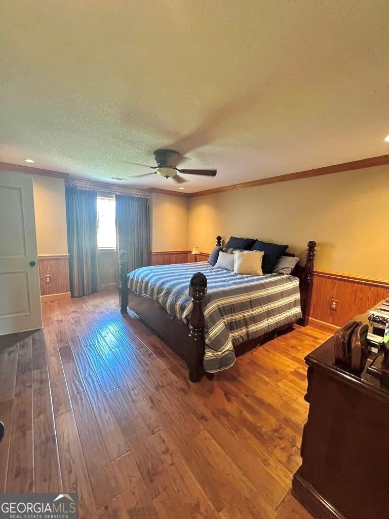 3 Chestnut Road Hazlehurst, GA 31539 - Photo 29 of 66 a bedroom with a bed and wooden floor