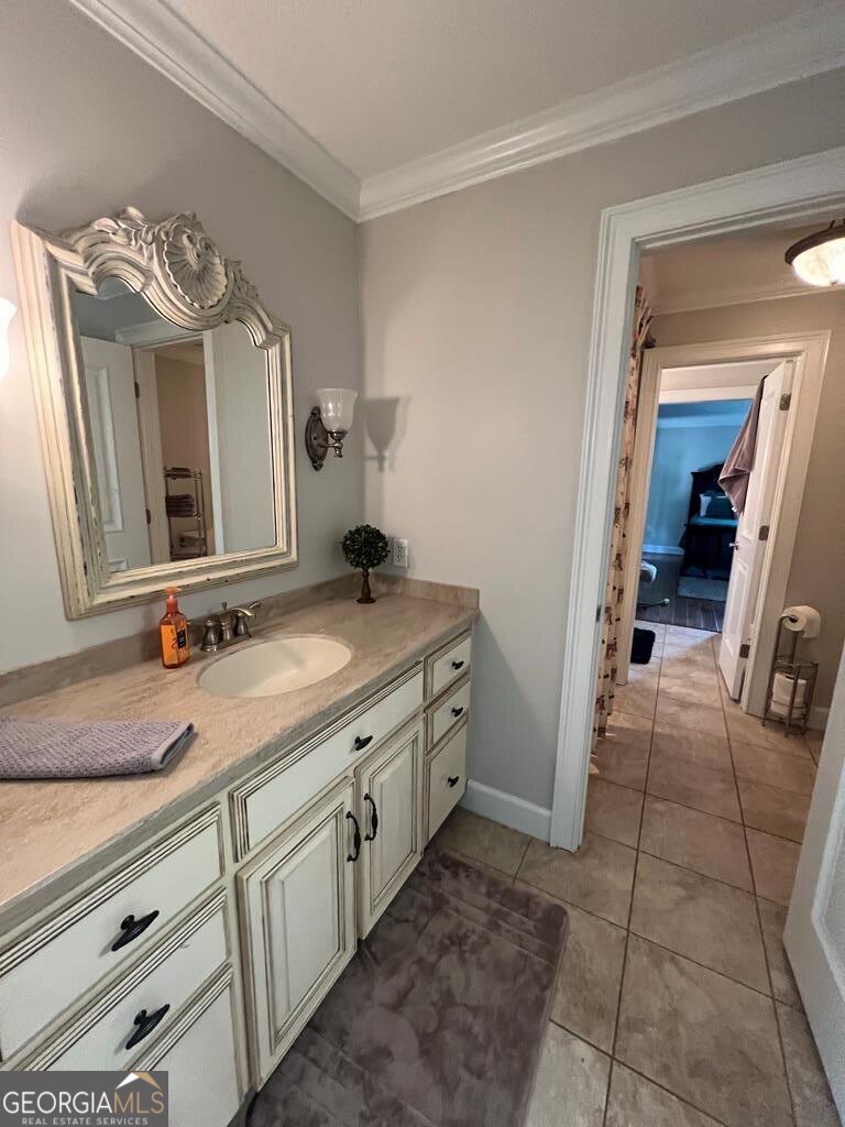 3 Chestnut Road Hazlehurst, GA 31539 - Photo 33 of 66 a spacious bathroom with a granite countertop sink a mirror and a vanity