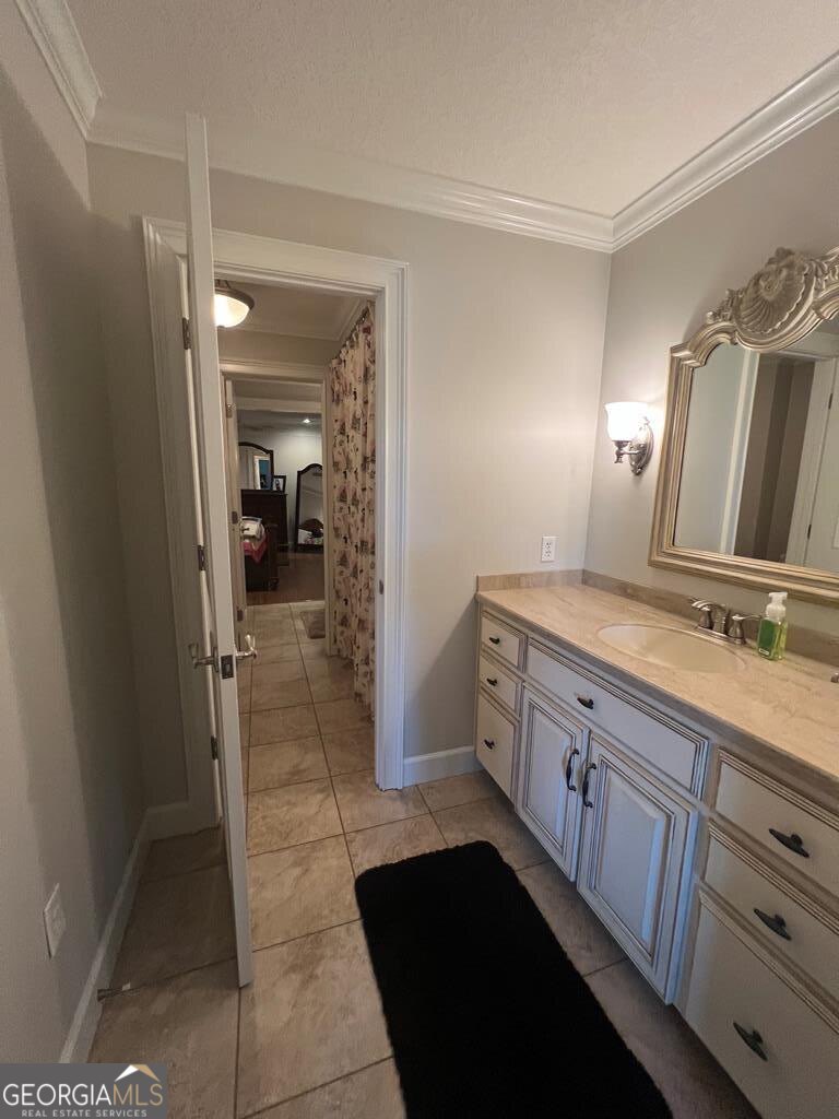 3 Chestnut Road Hazlehurst, GA 31539 - Photo 35 of 66 a bathroom with a double vanity sink a toilet and a mirror
