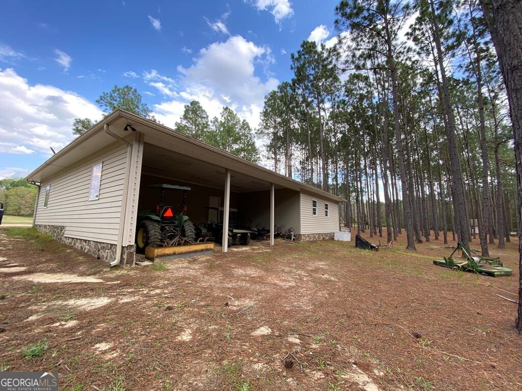 3 Chestnut Road Hazlehurst, GA 31539 - Photo 41 of 66 a view of a house with a patio and a yard