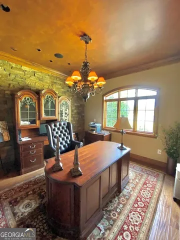 a kitchen with stainless steel appliances granite countertop a stove a sink dishwasher and chairs