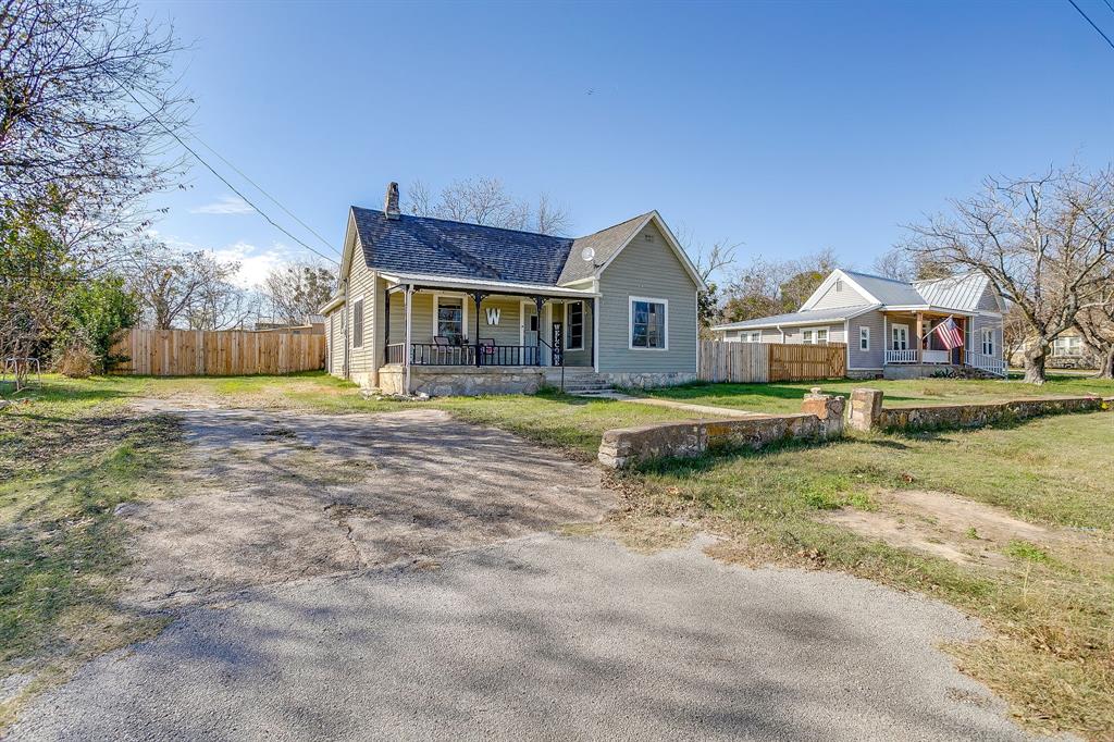 610 North Mesquite Hico, TX 76457 - Photo 2 of 34 View of front of property with covered porch, and driveway