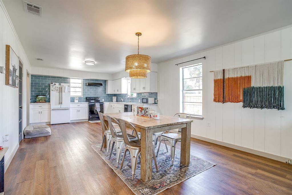 610 North Mesquite Hico, TX 76457 - Photo 8 of 34 Dining area with dark wood-style floors and crown molding