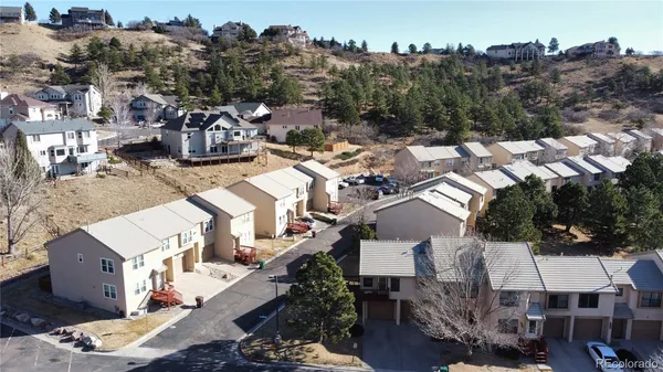 an aerial view of a house with outdoor space