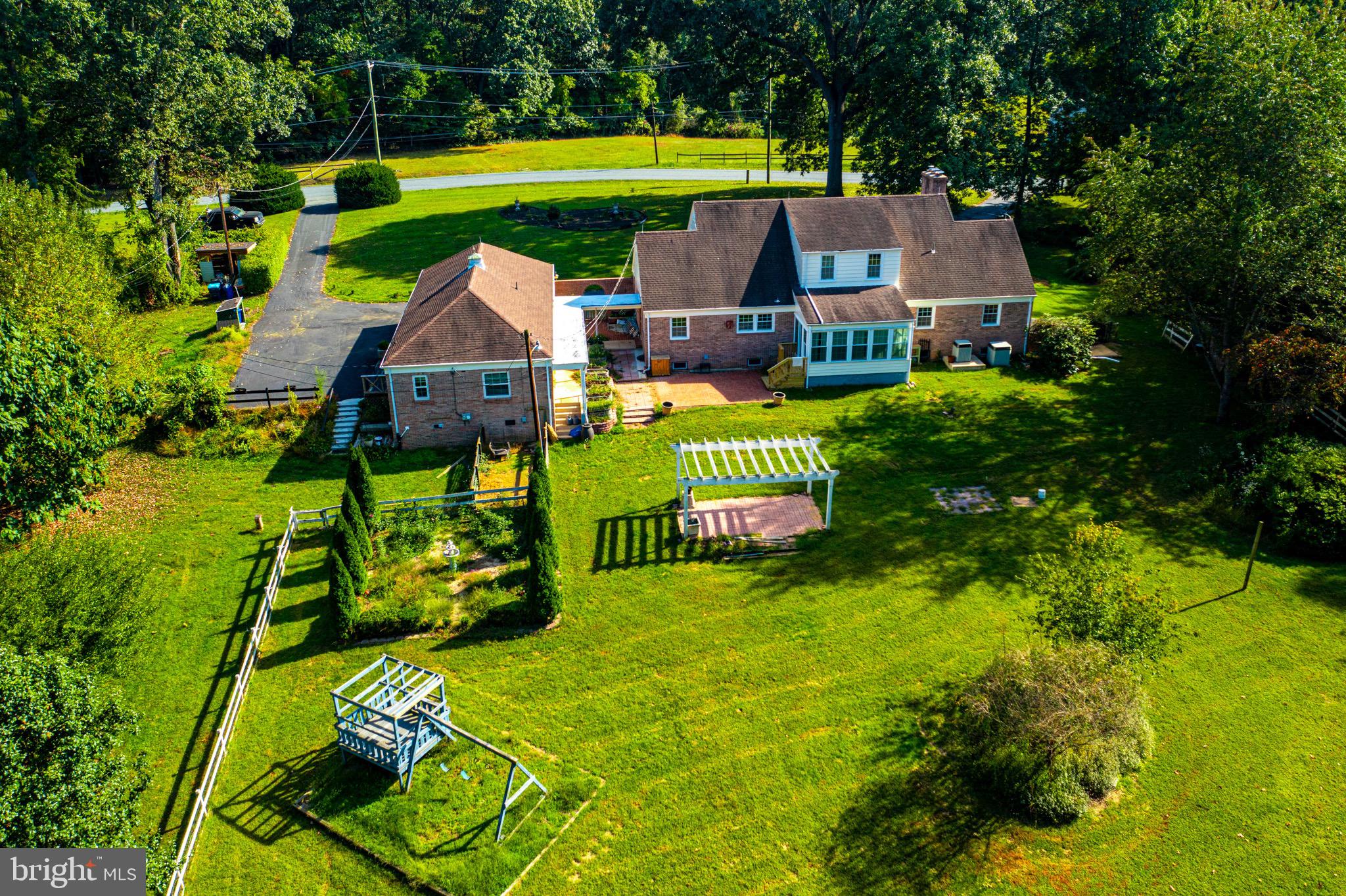 3908 Street Road Street, MD 21154 - Photo 15 of 106 Backyard with rose garden, pergola and swing set