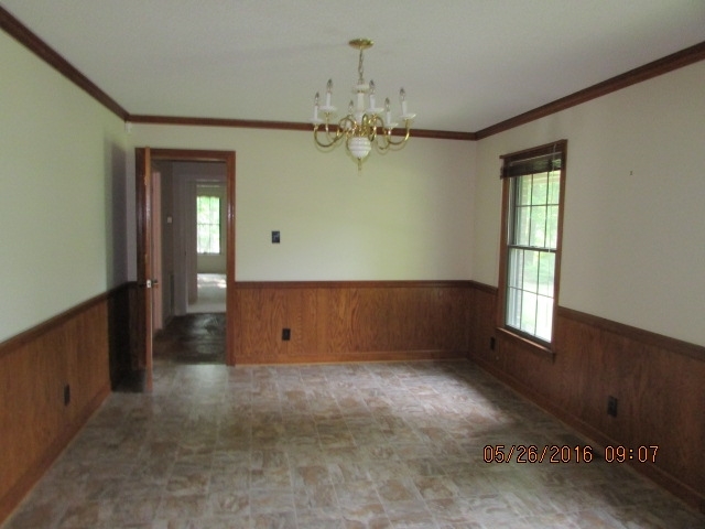 5835 Huddersfield Road Macon, GA 31210 - Photo 10 of 19 wooden floor in an empty room with a window