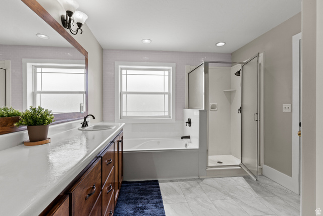 75 East 200 North Mendon, UT 84325 - Photo 15 of 36 Bathroom featuring a shower stall, a garden tub, vanity, recessed lighting, and light marble finish floors