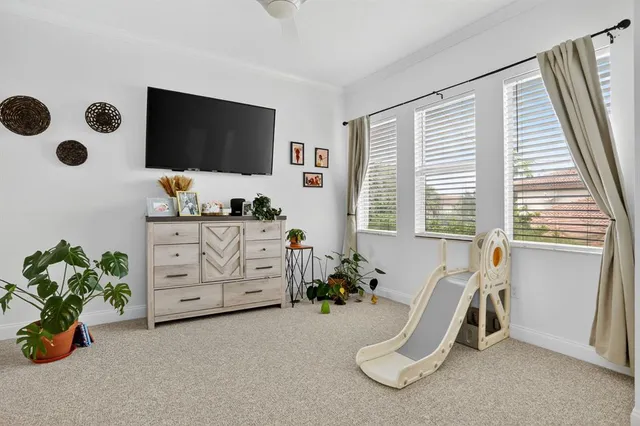 a room with furniture and flat screen tv