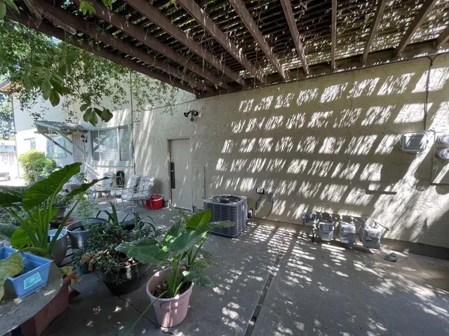 a flower pot with wooden fence