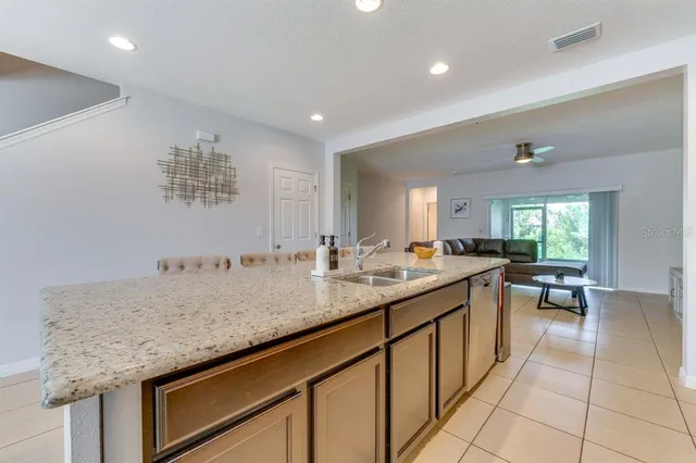 a kitchen with a sink and cabinets