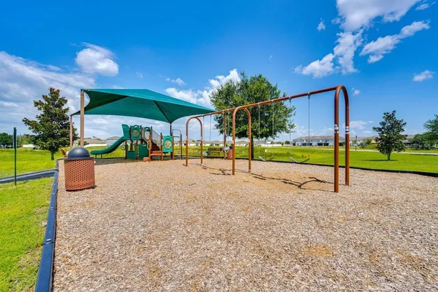 a view of a house with a yard porch and sitting area