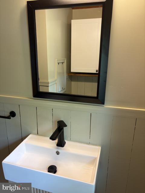 809 Salisbury Park Road Hague, VA 22469 - Photo 14 of 17 Sleek modern sink with stylish mirror.