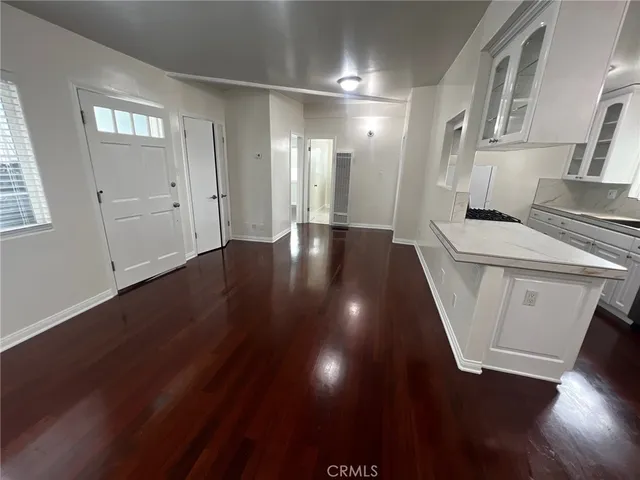 a view of a livingroom with wooden floor