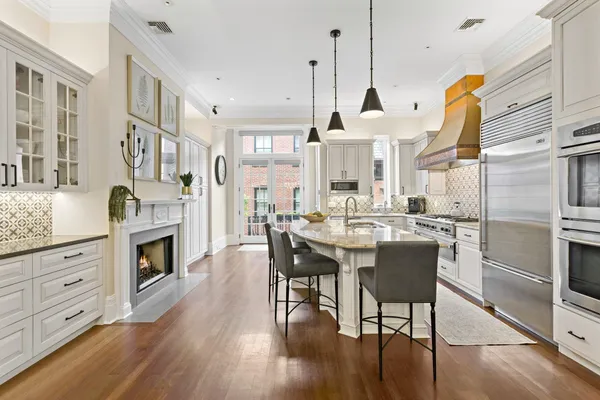 a view of kitchen and dining room with wooden floor