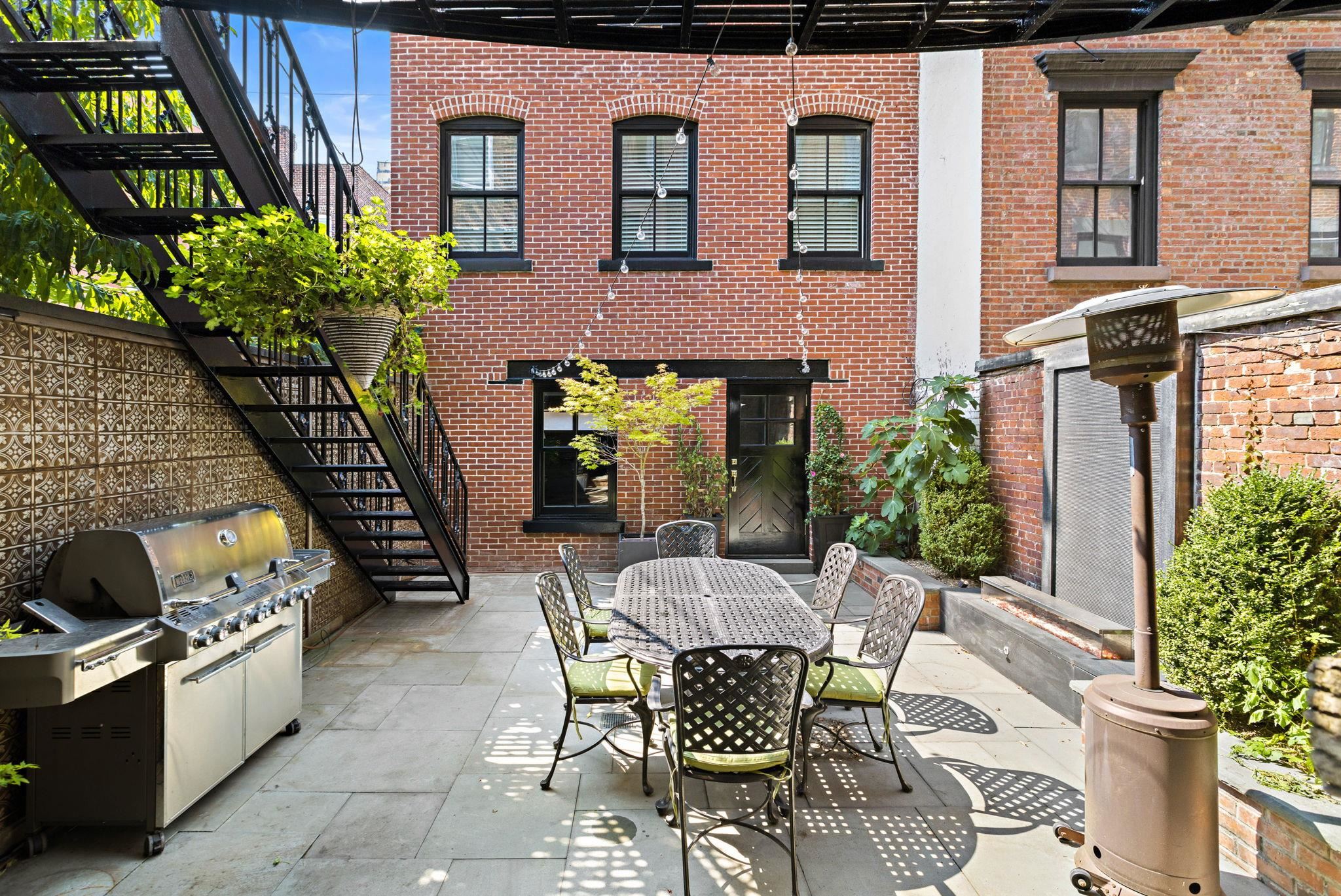 630 Hudson Street Hoboken, NJ 07030 - Photo 18 of 50 a view of a backyard with sitting area