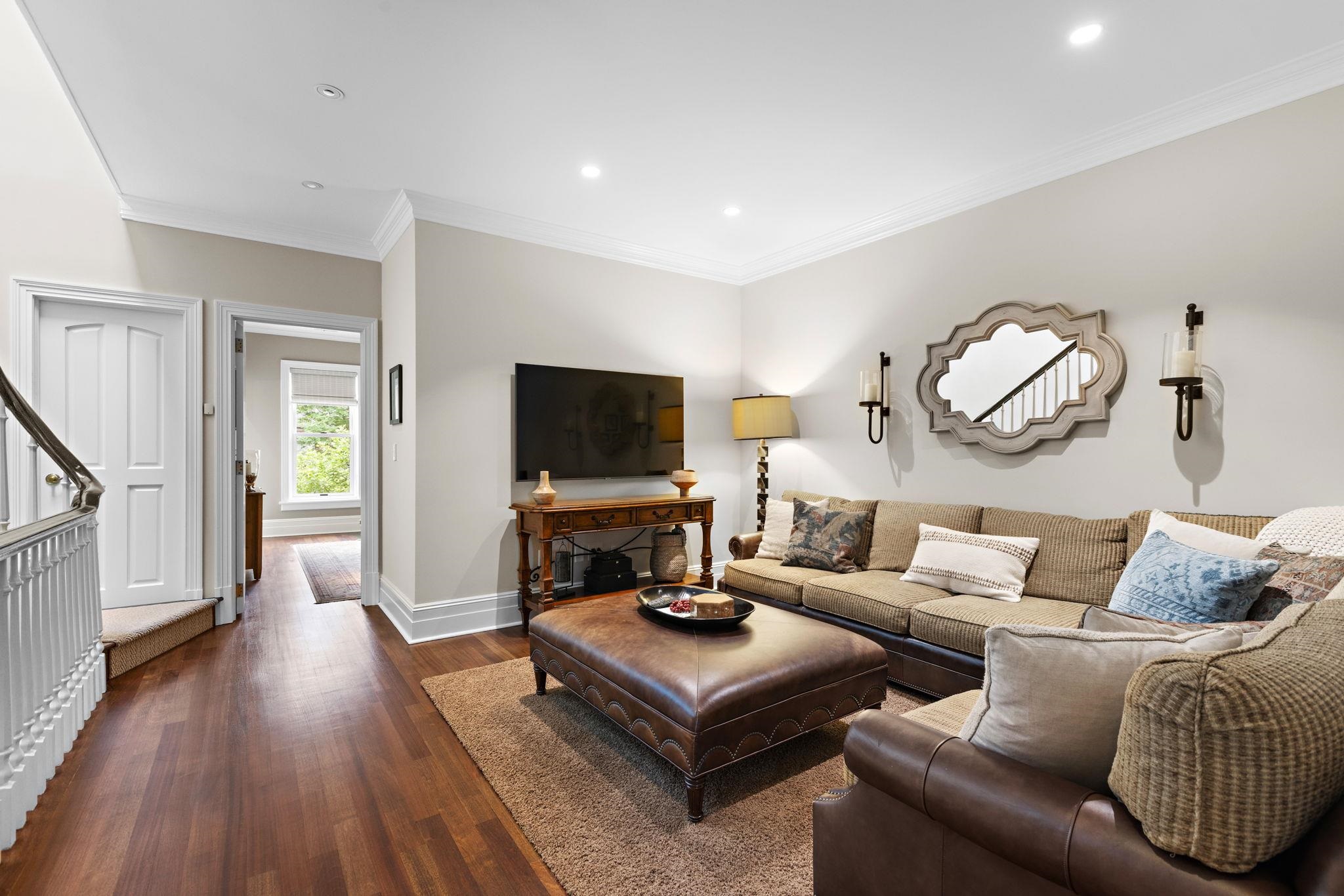 630 Hudson Street Hoboken, NJ 07030 - Photo 22 of 50 a living room with furniture and a flat screen tv