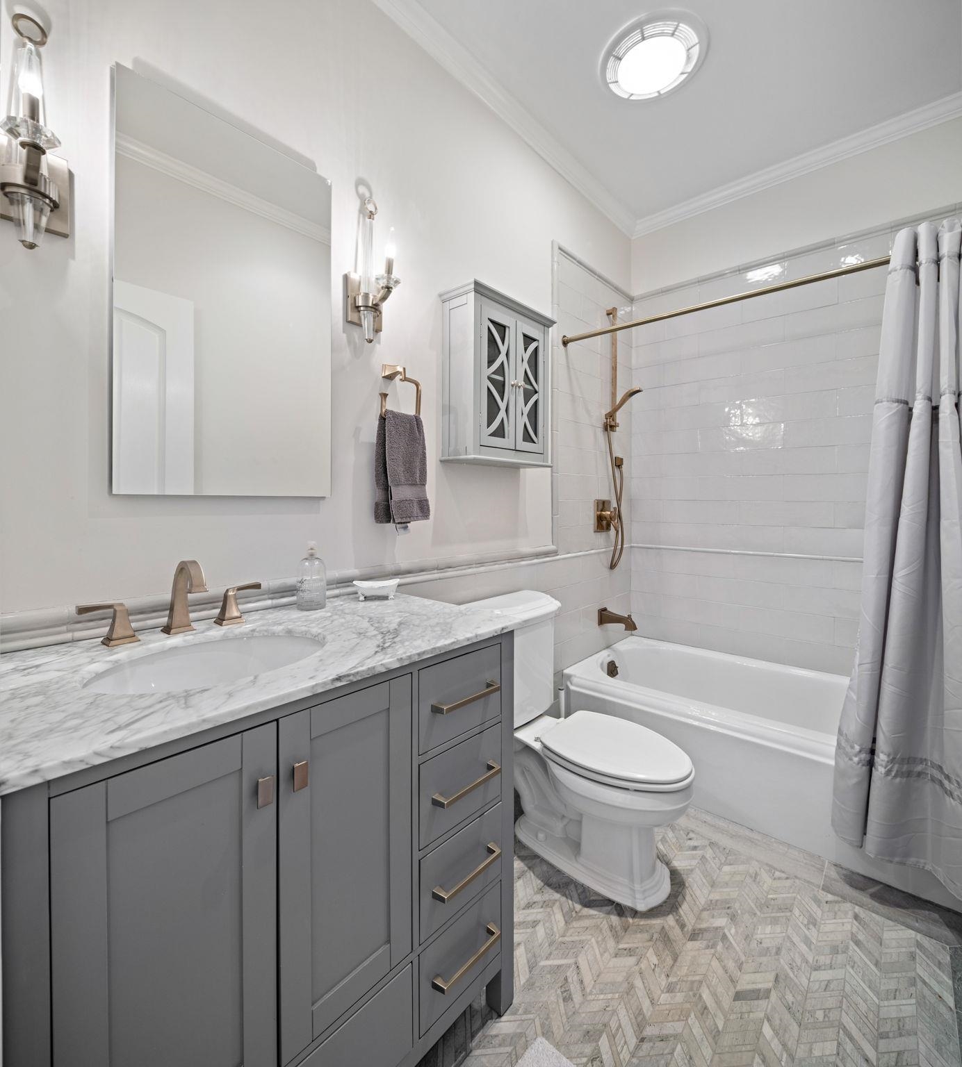 630 Hudson Street Hoboken, NJ 07030 - Photo 25 of 50 a bathroom with a granite countertop sink toilet and shower