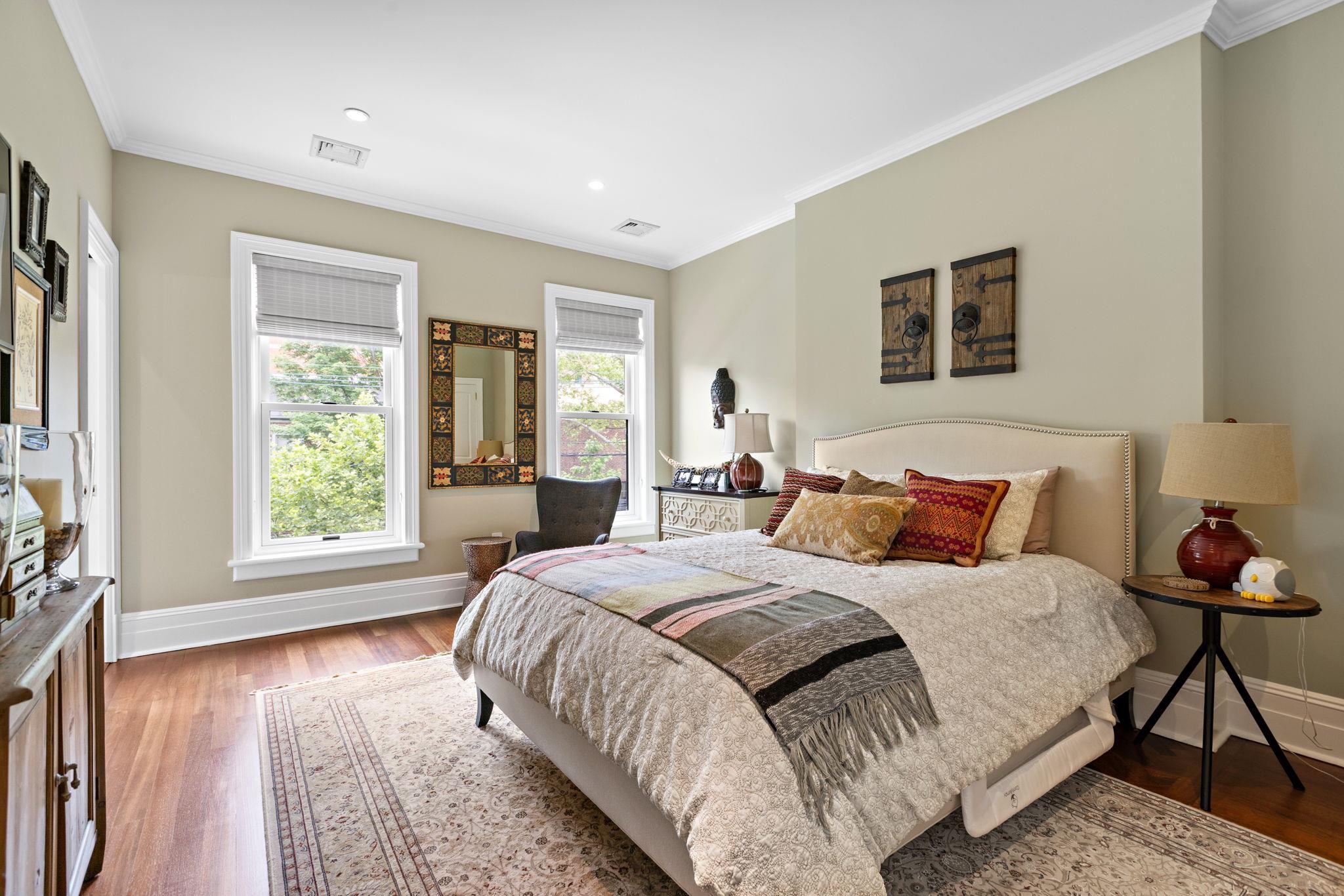 630 Hudson Street Hoboken, NJ 07030 - Photo 26 of 50 a bedroom with a bed and wooden floor