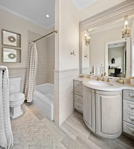 a bathroom with a toilet a sink and a bathtub