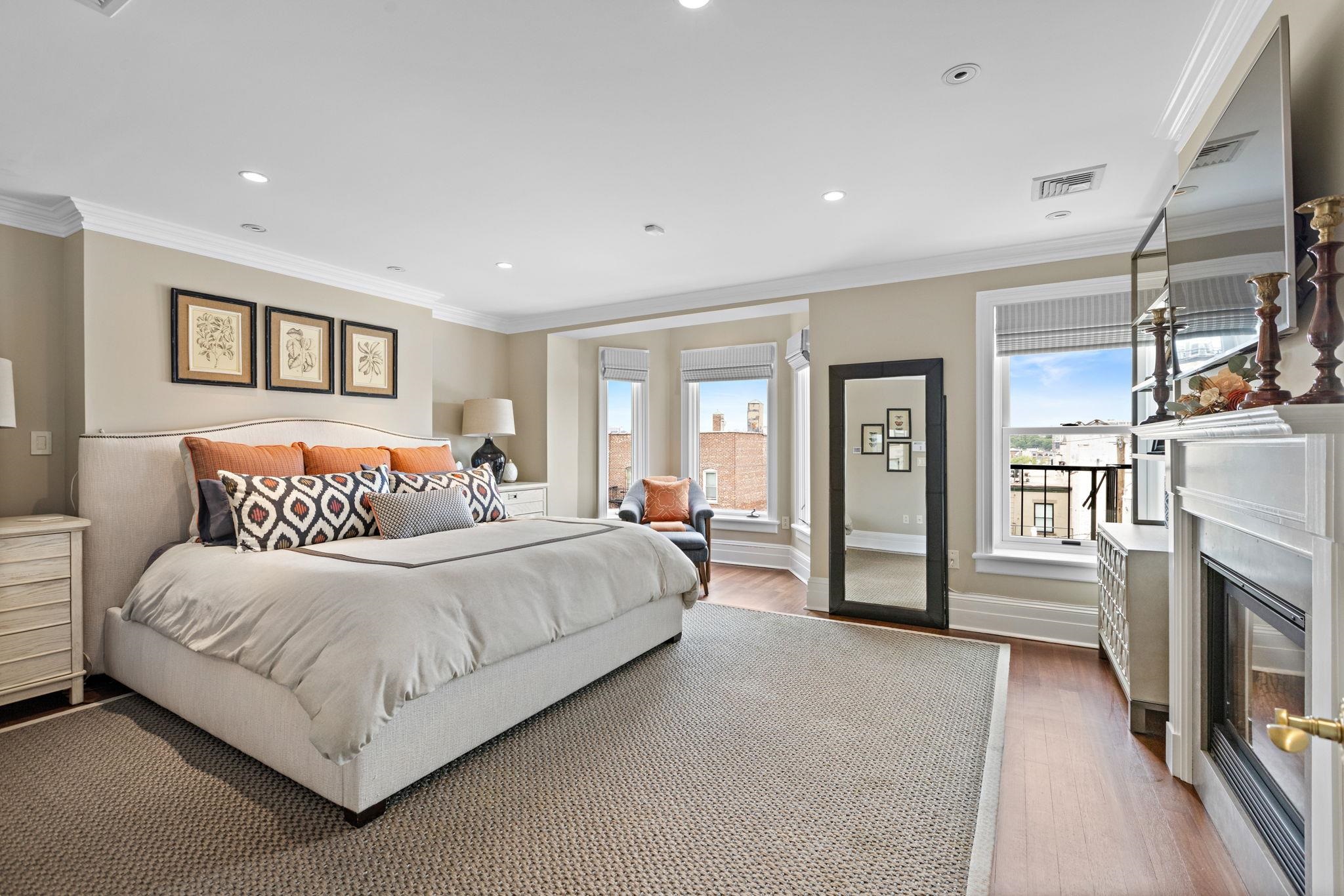 630 Hudson Street Hoboken, NJ 07030 - Photo 28 of 50 a bed room with a bed and a television