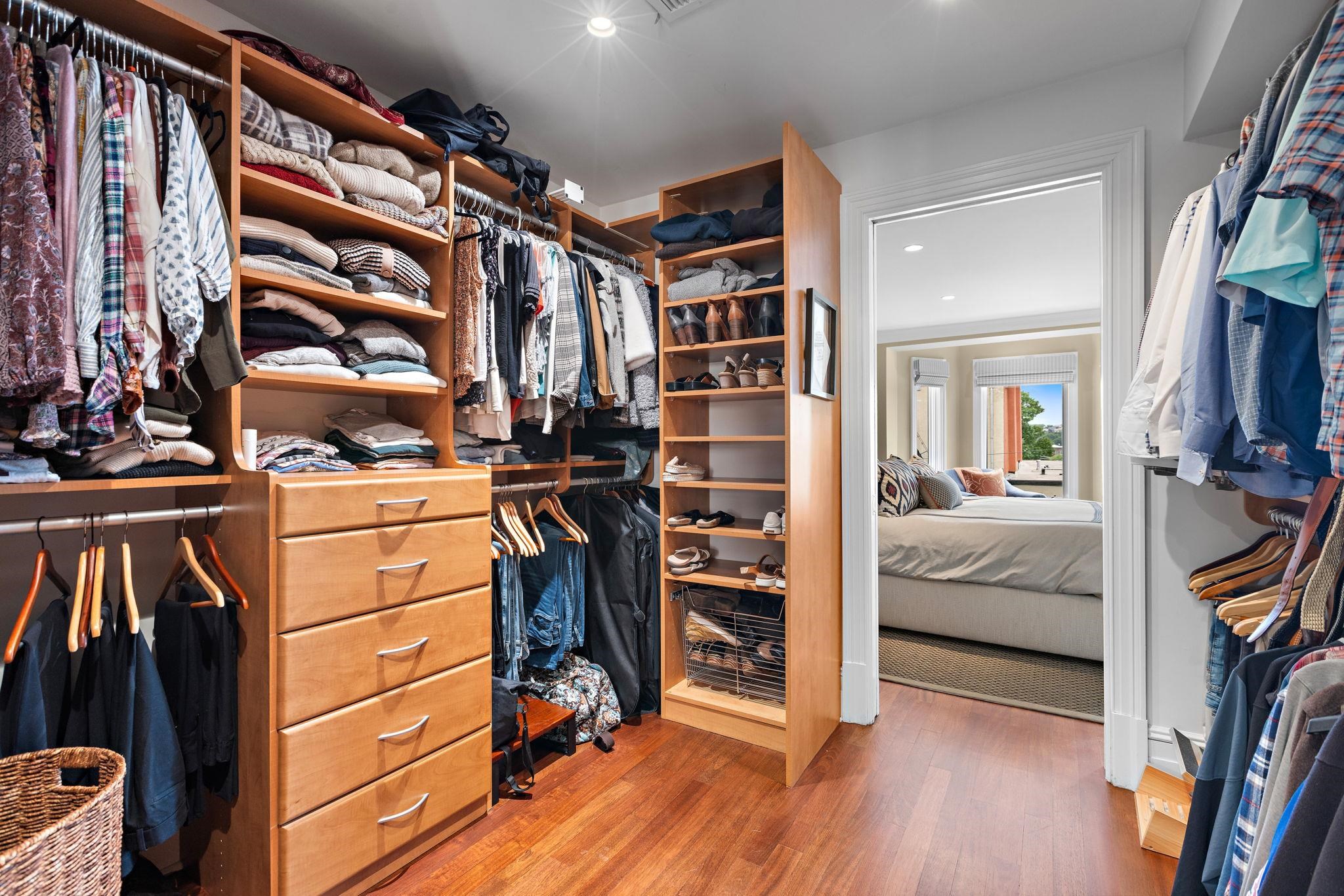 630 Hudson Street Hoboken, NJ 07030 - Photo 31 of 50 a view of walk in closet with clothes and shoes