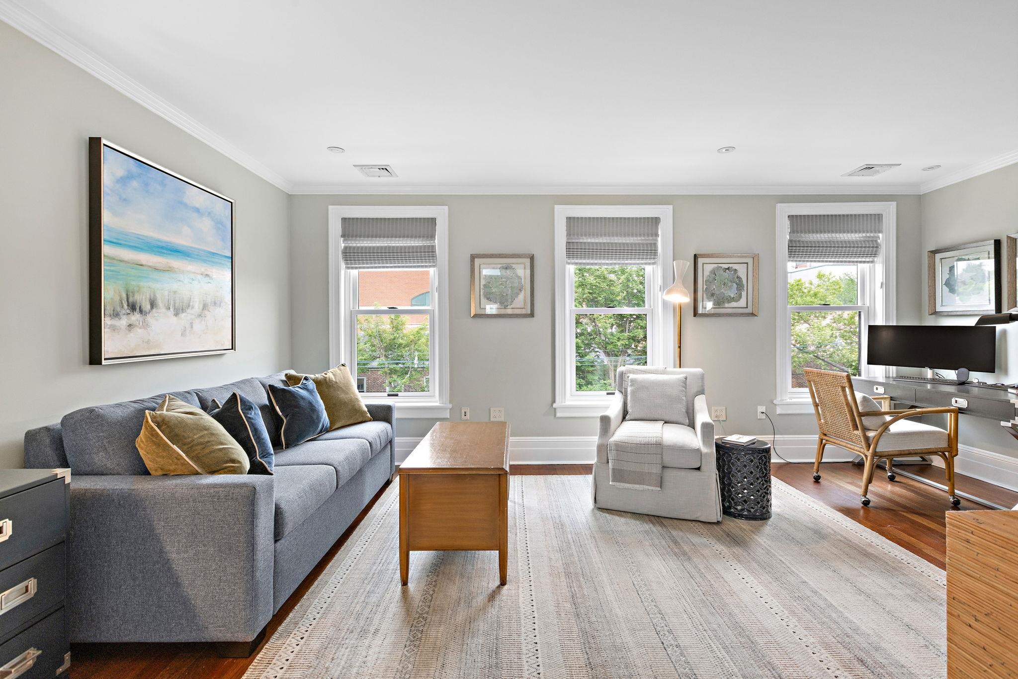630 Hudson Street Hoboken, NJ 07030 - Photo 36 of 50 a living room with furniture and a large window