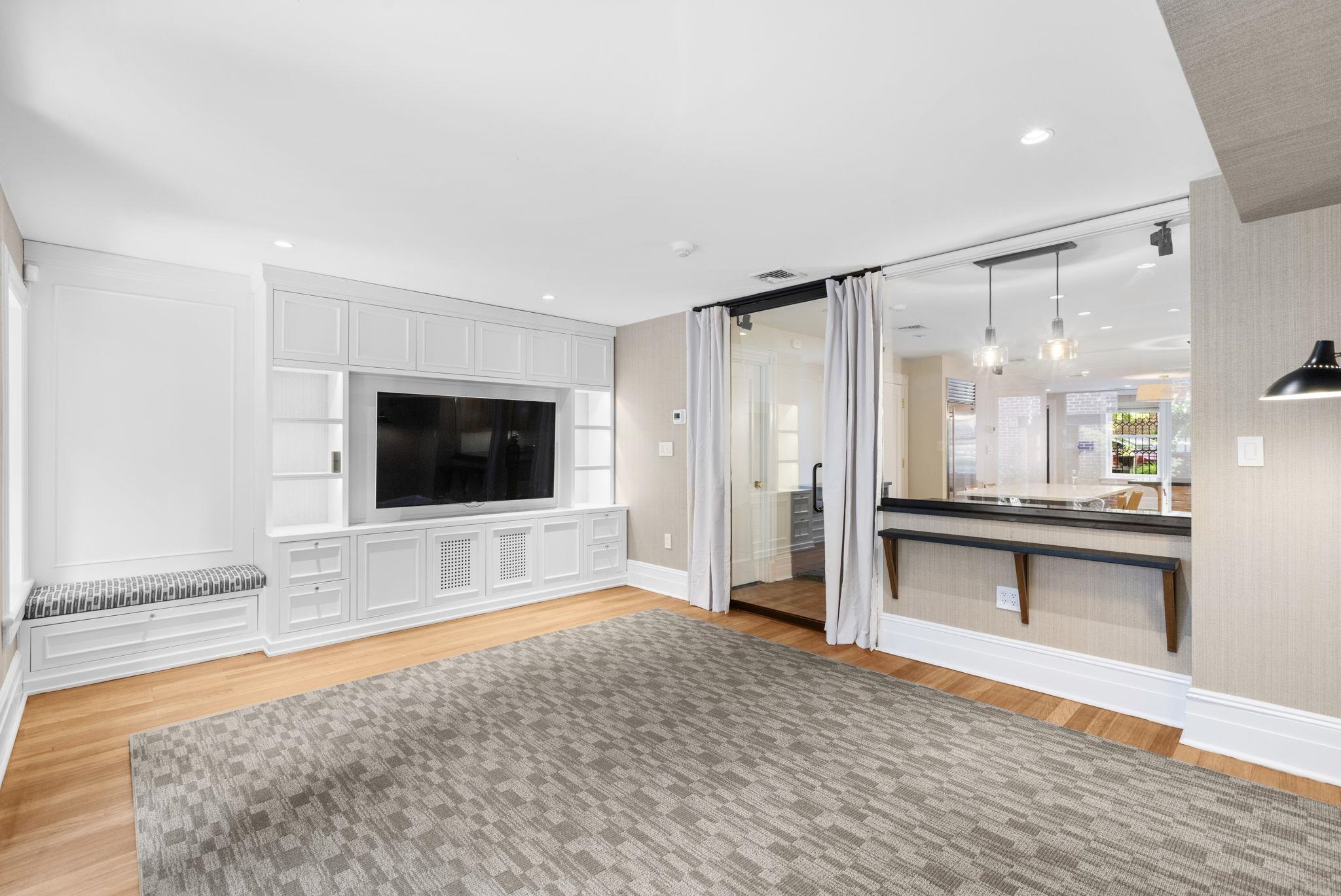 630 Hudson Street Hoboken, NJ 07030 - Photo 44 of 50 a living room with furniture and a flat screen tv