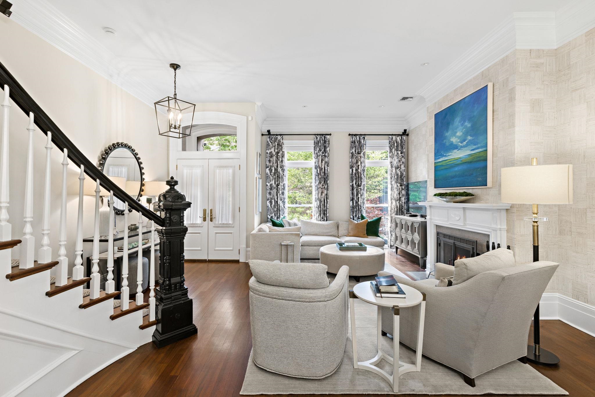 630 Hudson Street Hoboken, NJ 07030 - Photo 7 of 50 a living room with furniture a fireplace and a chandelier