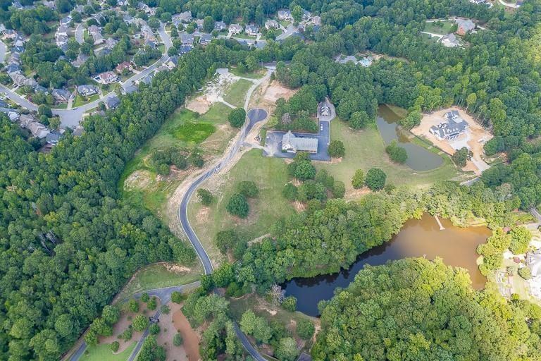 5775 Kennedy Road Suwanee, GA 30024 - Photo 17 of 23 an aerial view of residential house with outdoor space and swimming pool