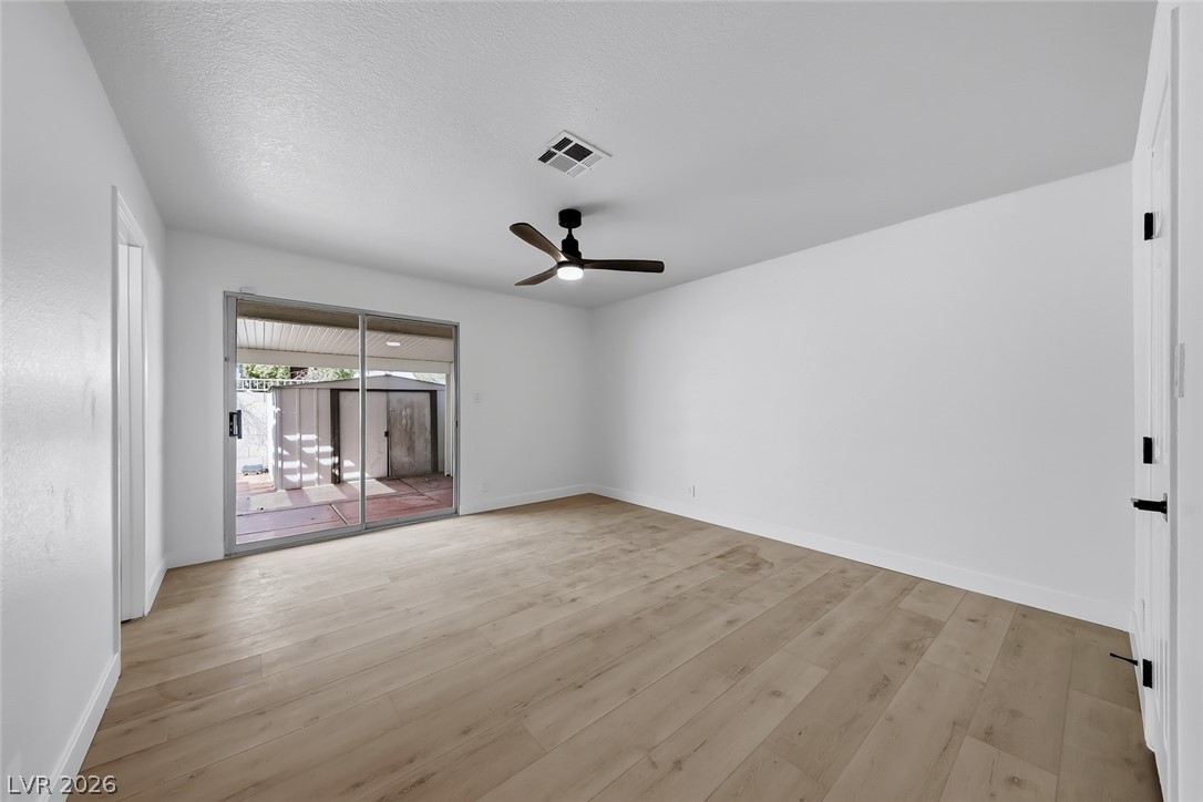 434 Crestway Road Henderson, NV 89015 - Photo 25 of 46 Unfurnished room with light wood finished floors and a ceiling fan
