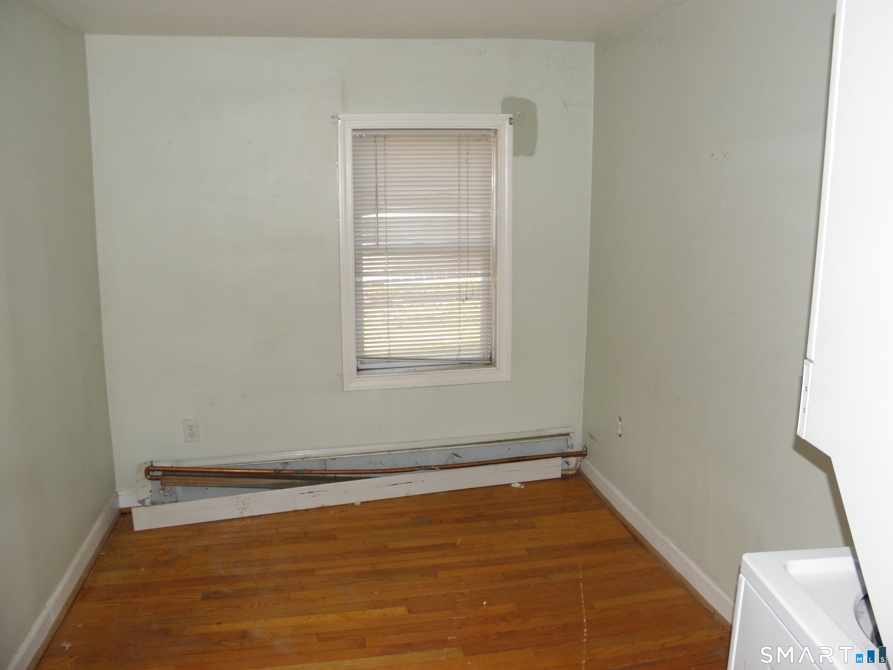 27 Fox Trail Coventry, CT 06238 - Photo 10 of 13 a view of a room with wooden floor and window