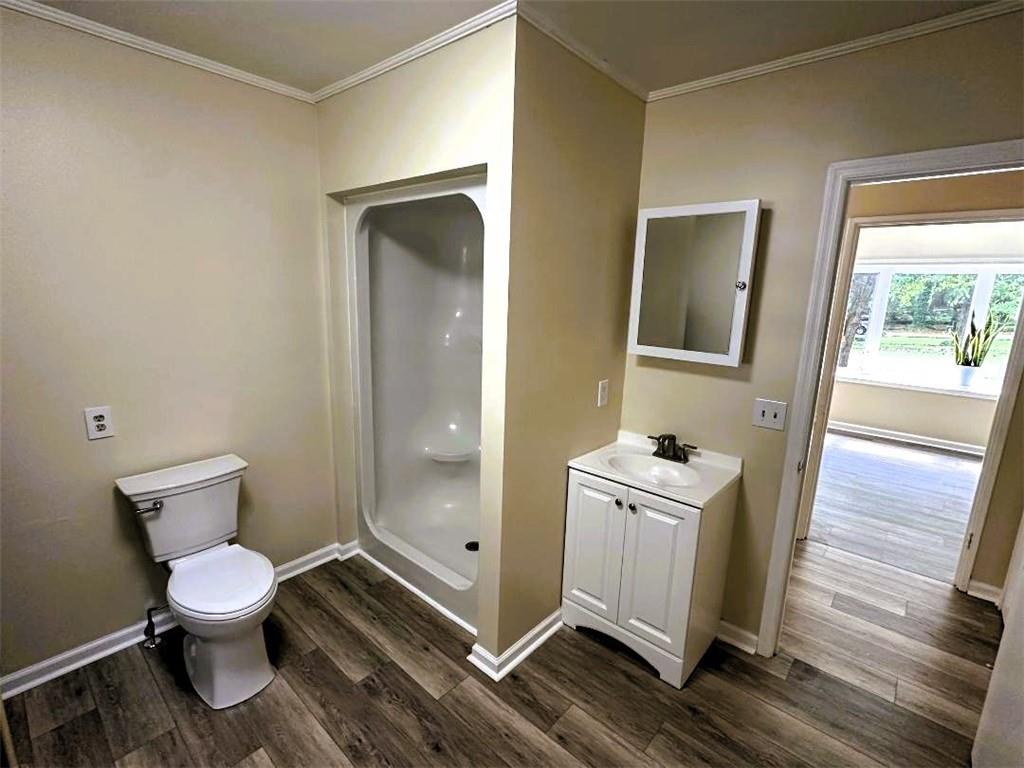 121 Hunt Drive Calhoun, GA 30701 - Photo 16 of 20 a bathroom with a toilet sink and mirror