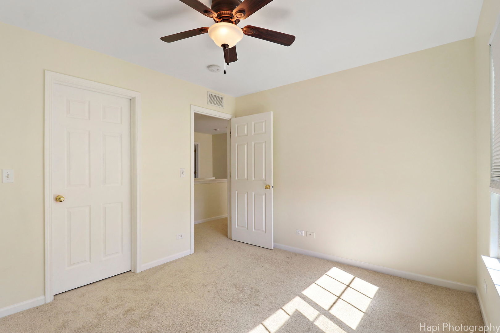 5332 Wildspring Drive, Unit 5332 Lake In The Hills, IL 60156 - Photo 22 of 29 an empty room with windows and fan