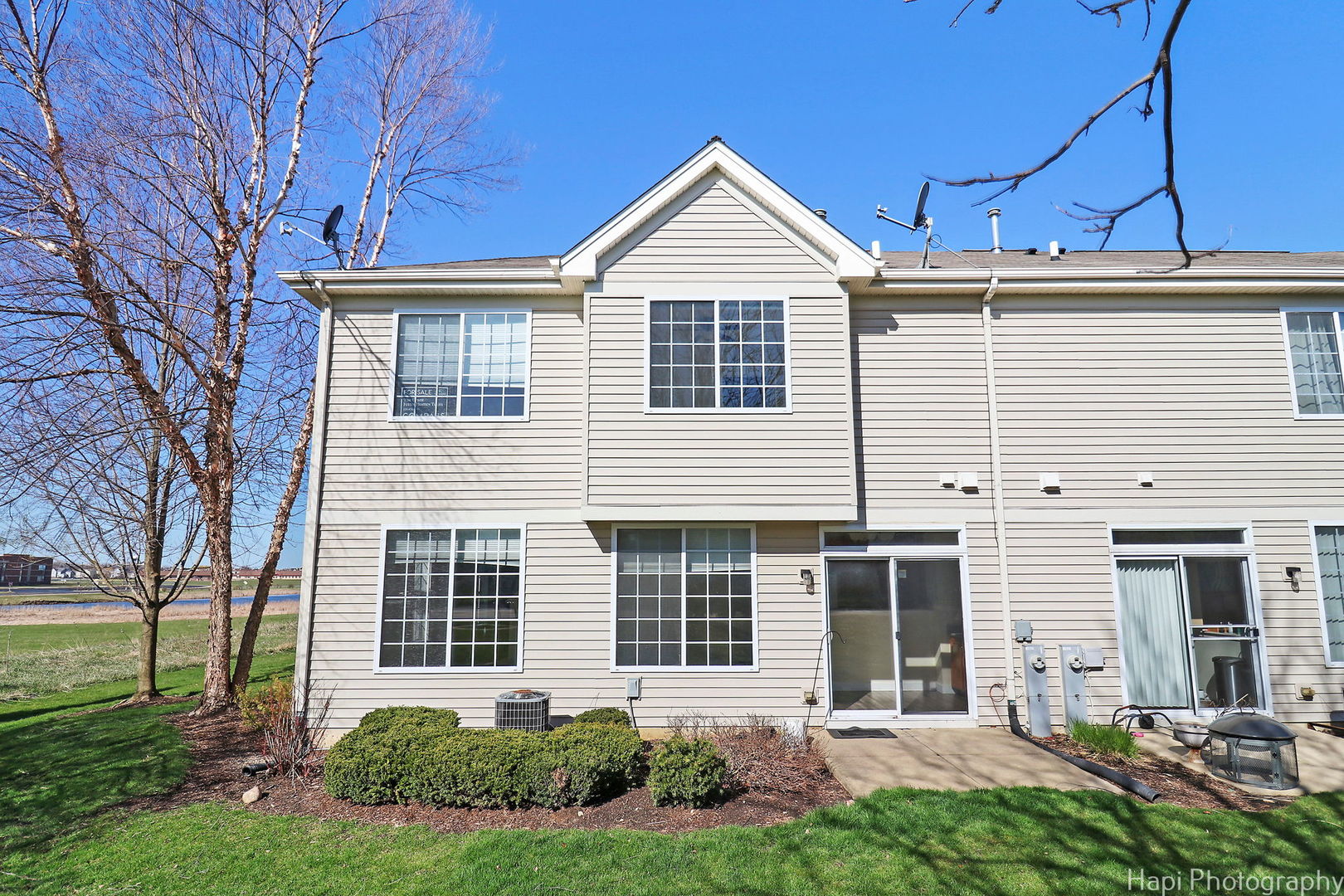 5332 Wildspring Drive, Unit 5332 Lake In The Hills, IL 60156 - Photo 24 of 29 a front view of a house with a yard and garage