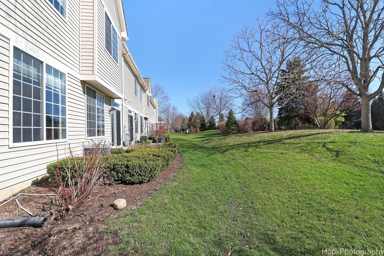 5332 Wildspring Drive, Unit 5332 Lake In The Hills, IL 60156 - Photo 26 of 29 a view of a house with a yard