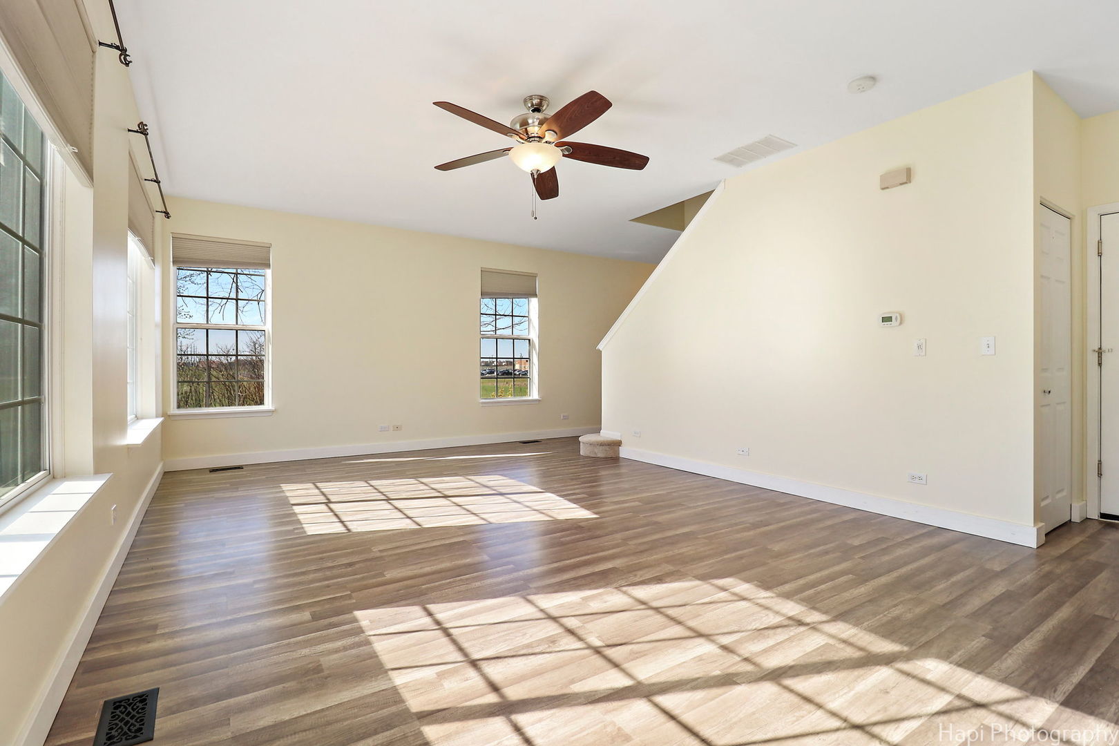 5332 Wildspring Drive, Unit 5332 Lake In The Hills, IL 60156 - Photo 4 of 29 a view of an empty room with wooden floor and a window