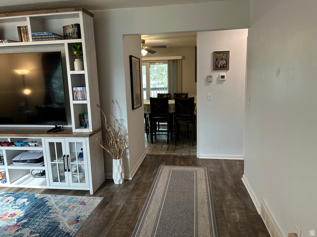 7659 State Street Midvale, UT 84047 - Photo 4 of 33 Hallway featuring dark wood-type flooring