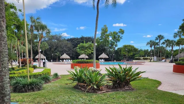 a view of a swimming pool with a patio